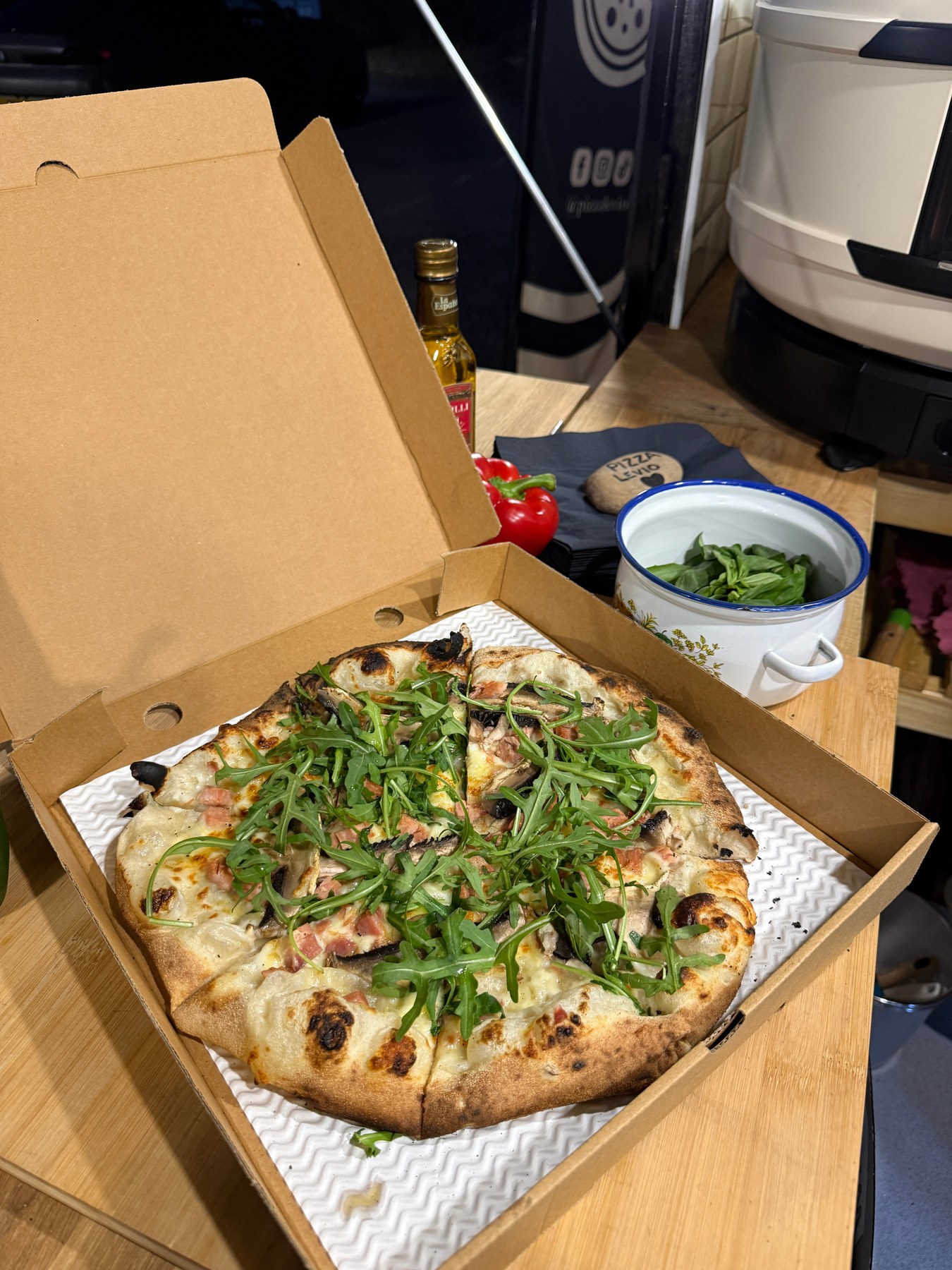 Stone-baked pizza topped with rocket